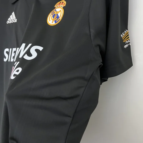 camiseta retro visitante negra real madrid 2002 2003 adidas 3 b79eaf6749288fd1e917104422602984 1024 1024